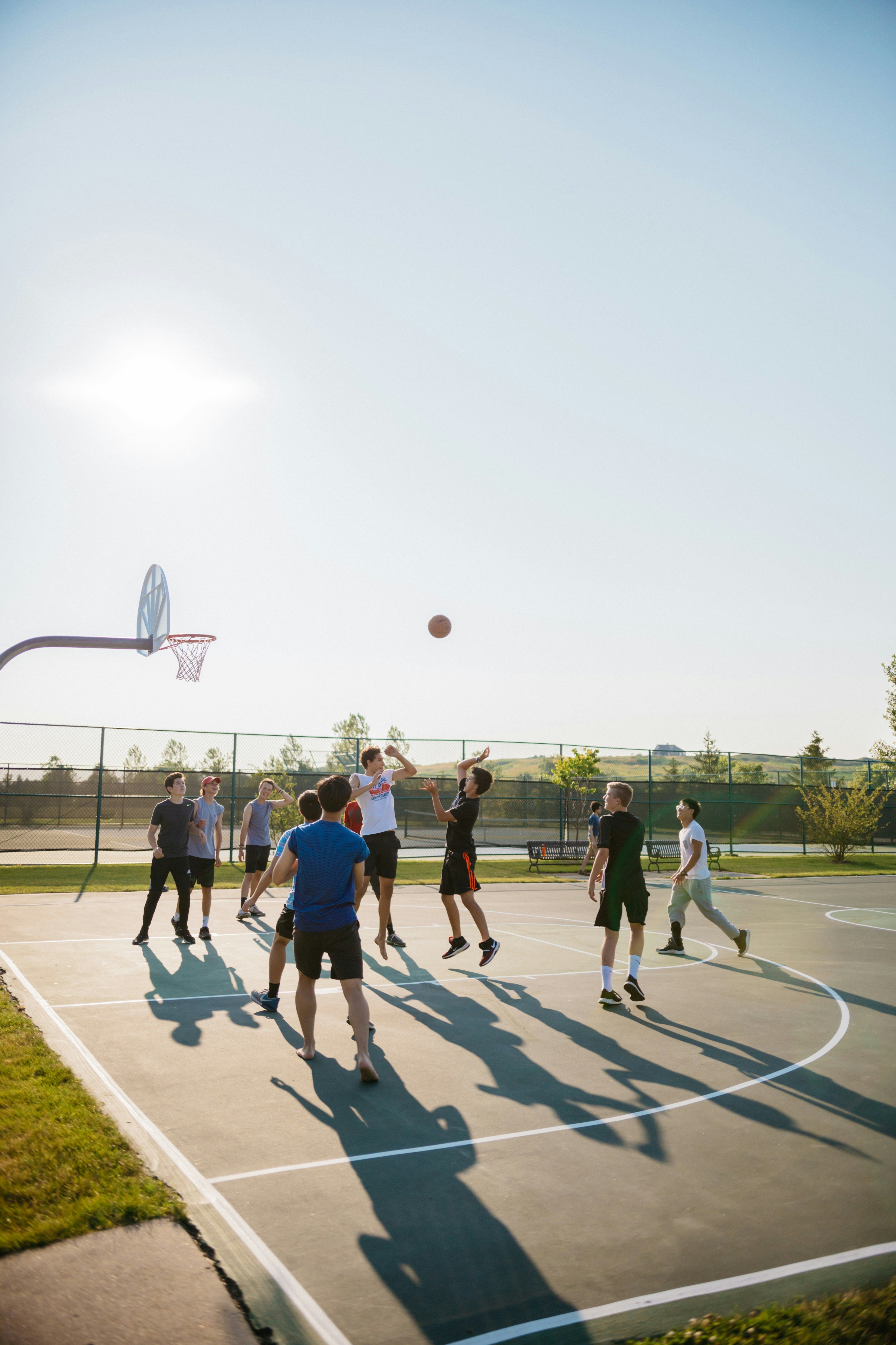 People playing basketball outside.