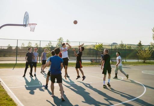 People playing basketball outside.