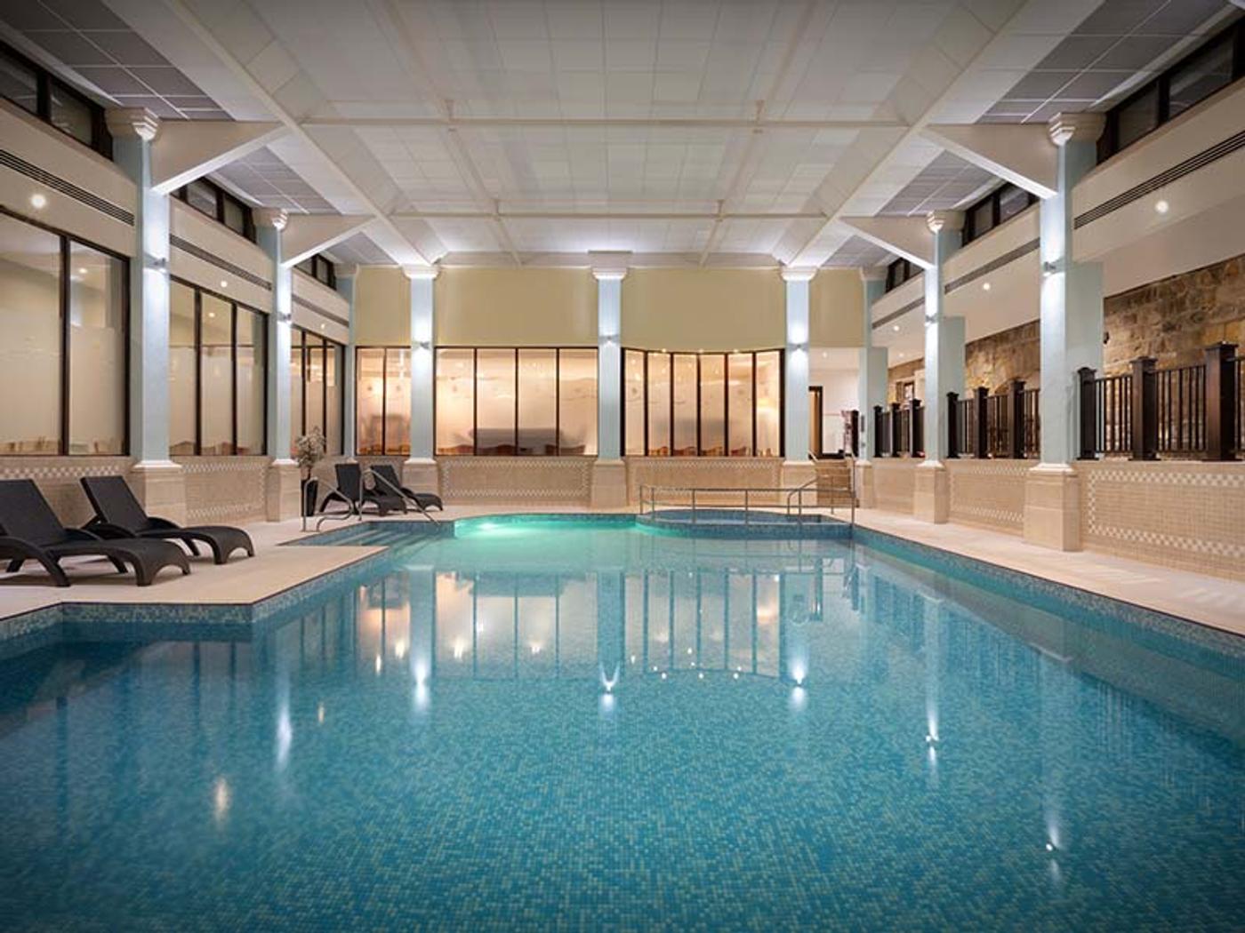 Heated indoor swimming pool at Delta Hotels Breadsall Priory Country Club's spa