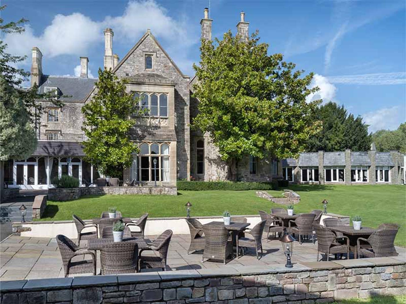 Terrace tables and chairs beside the manor house at Delta Hotels St. Pierre Country Club