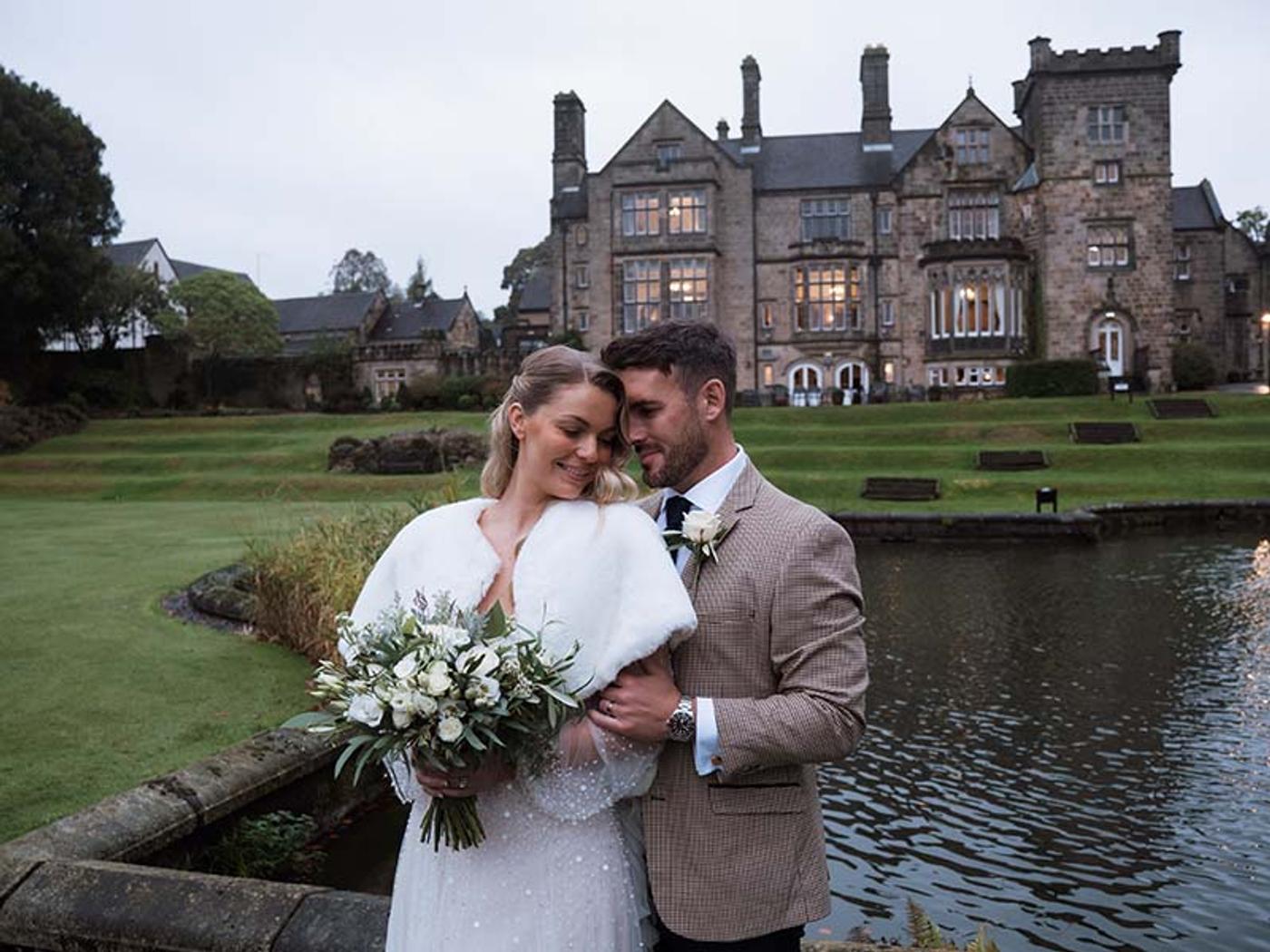 Couple's portrait in the grounds of Delta Hotels Breadsall Priory Country Club