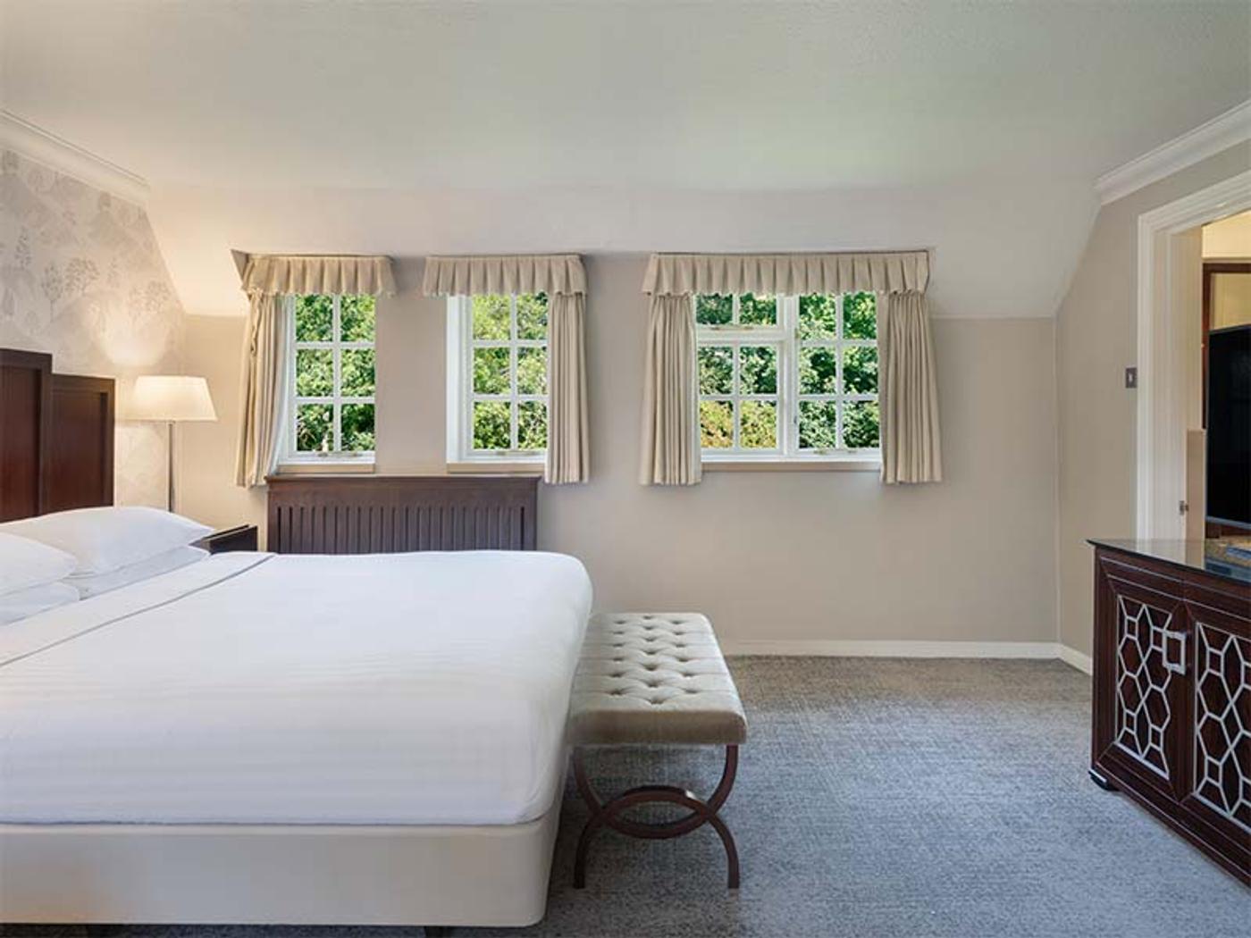 Rose Cottage Honeymoon Suite seating area in the historic courtyard at Delta Hotels St. Pierre Country Club