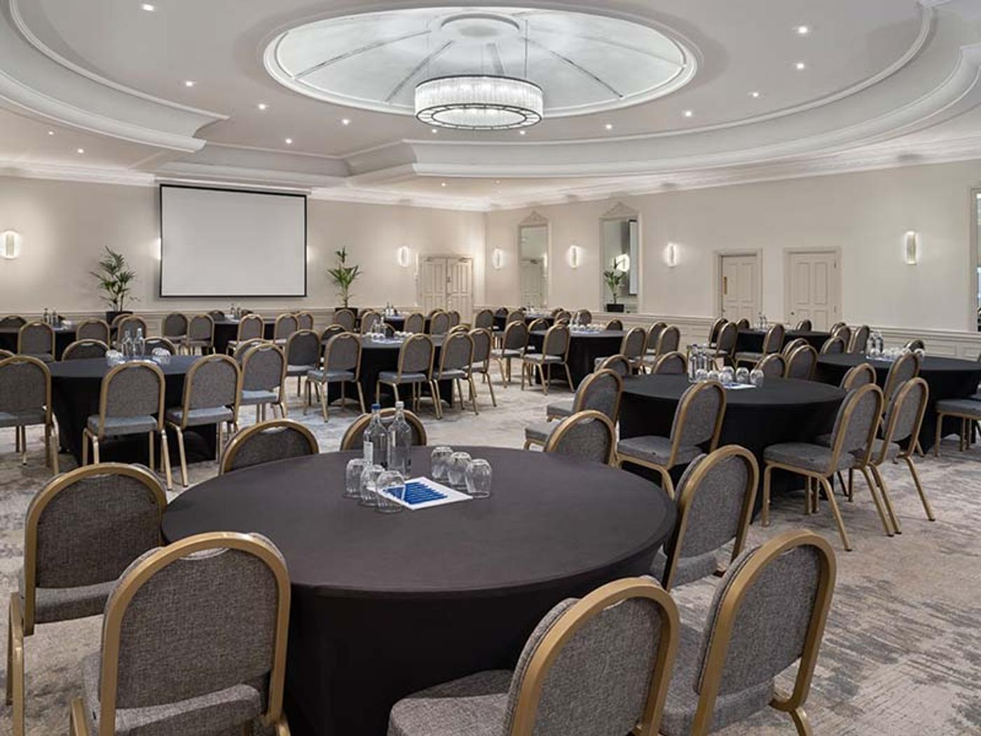 St Pierre Suite set up cabaret-style with round tables for a conference