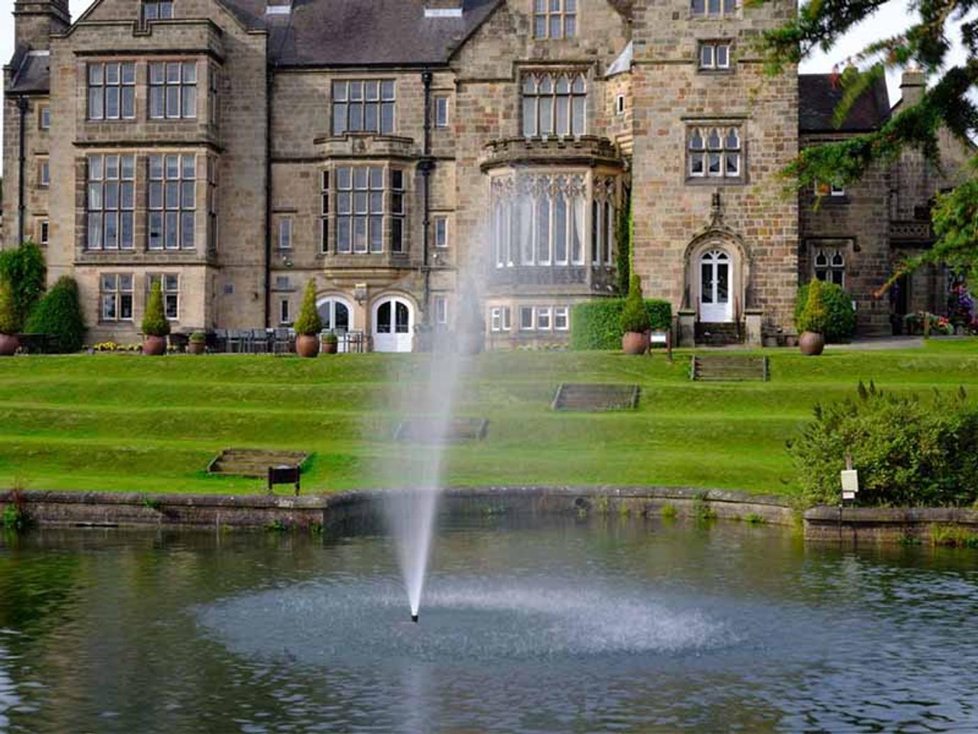 Fountain on the lake in front of Delta Hotels Breadsall Priory Country Club's manor house