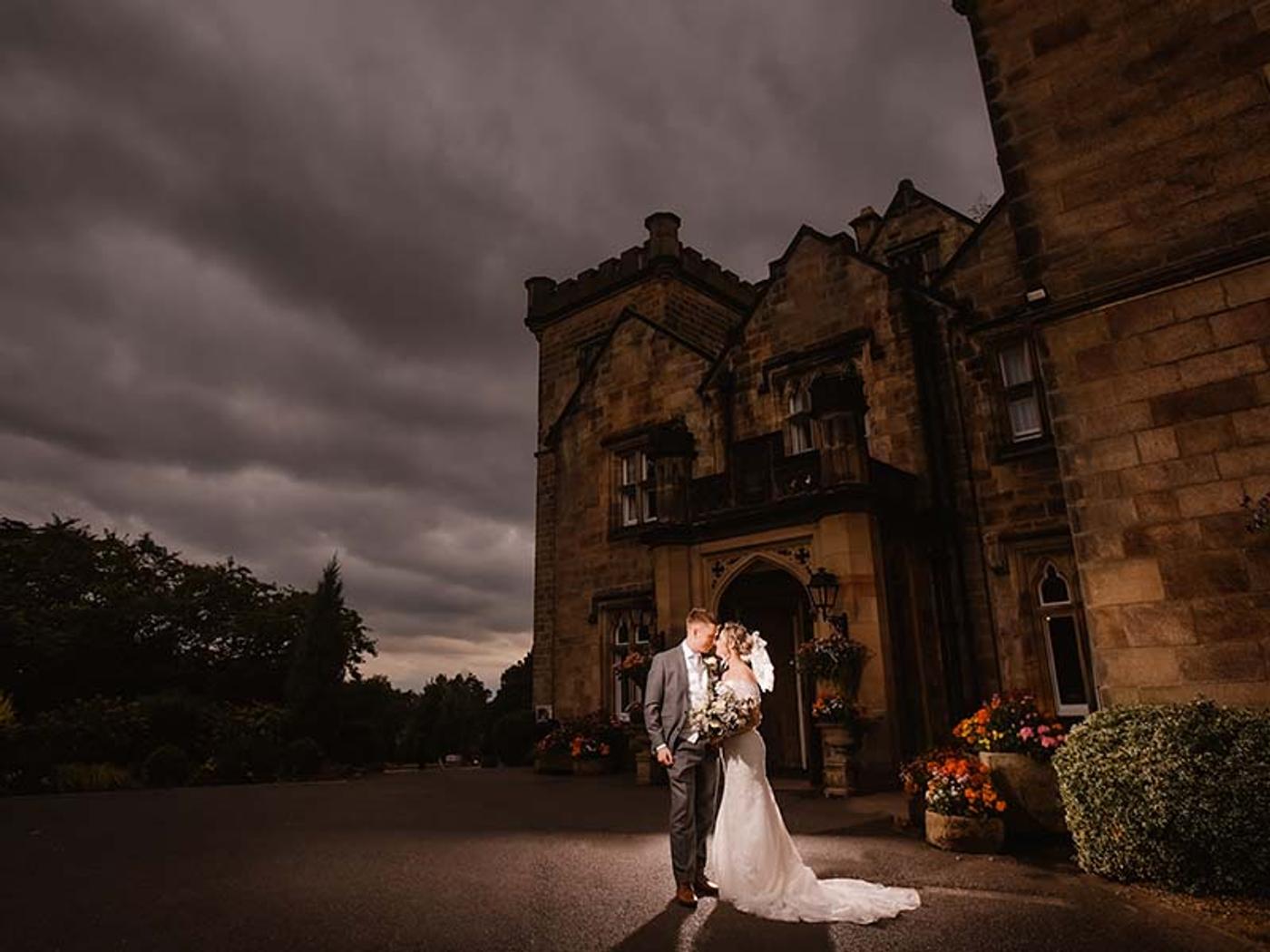 Wedding party portrait on the lawn at Delta Hotels Breadsall Priory Country Club