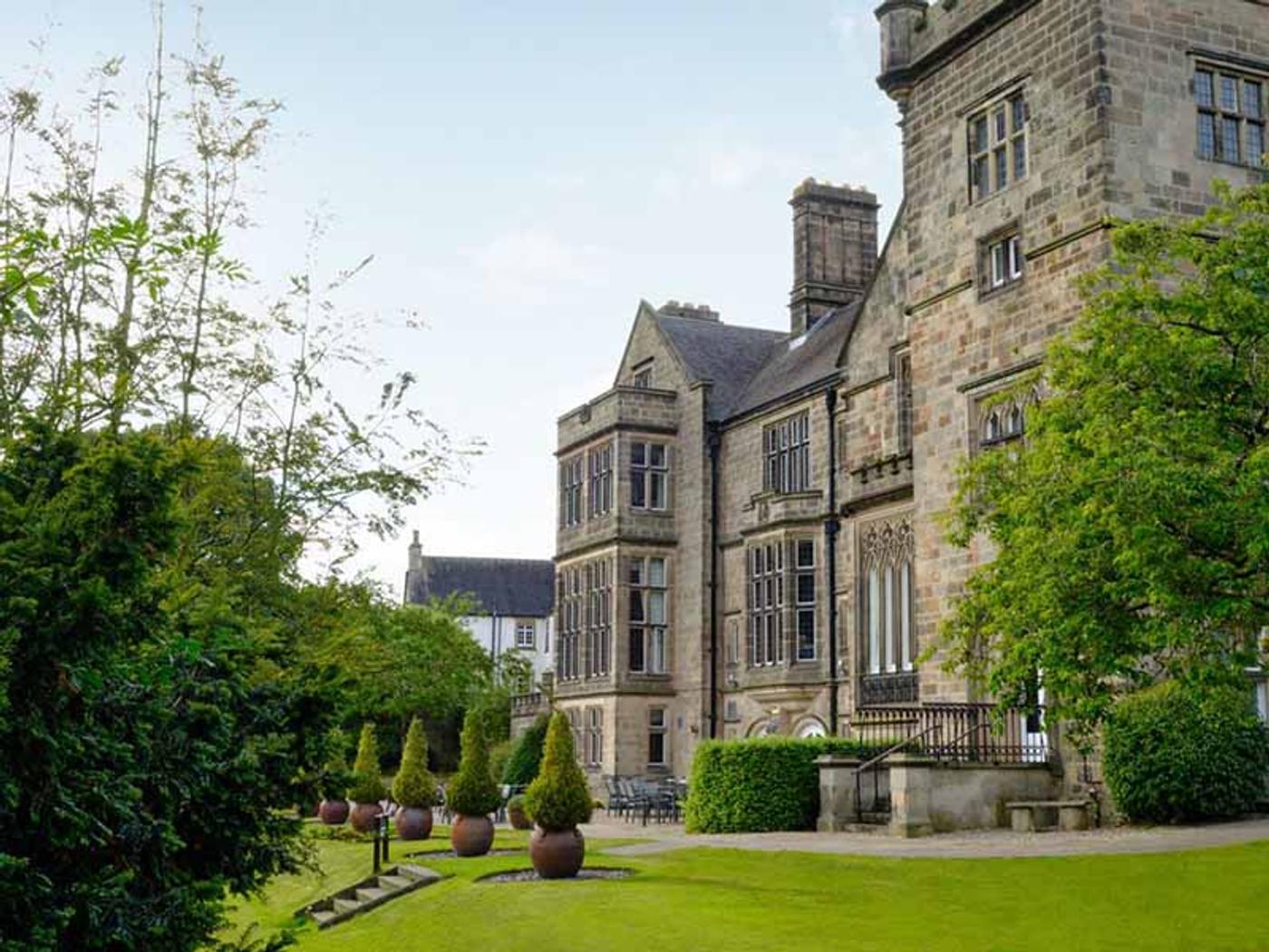 Manor house exterior and landscaped lawns at Delta Hotels Breadsall Priory Country Club