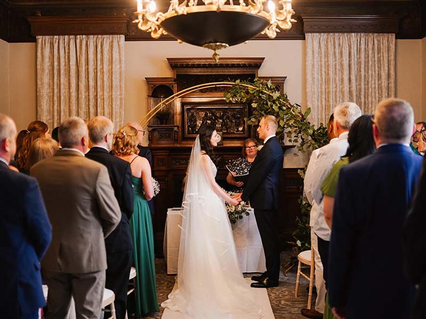 Bride and groom exchanging vows at Delta Hotels Breadsall Priory Country Club