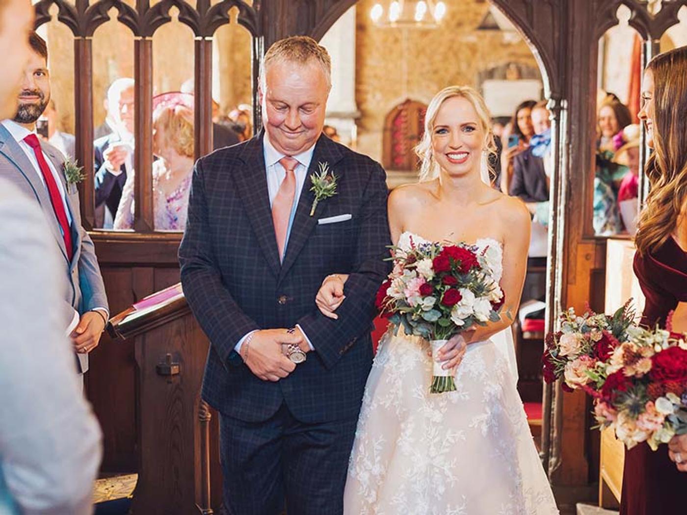 Bride and her father walking down the aisle at Delta Hotels St. Pierre Country Club's on-site church