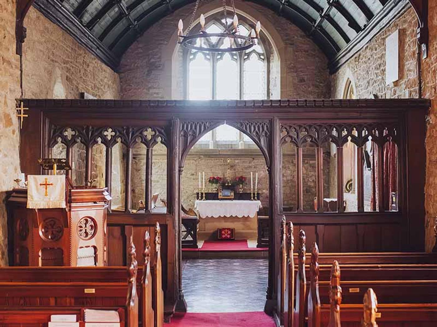 Interior of Delta Hotels St. Pierre Country Club's historic on-site church, aisle and altar