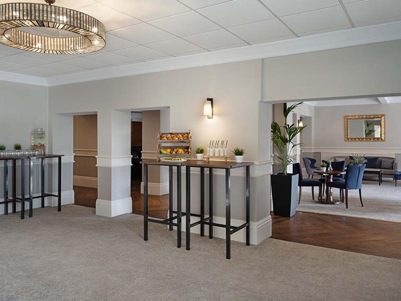 St Pierre Suite foyer set up with high tables for a reception