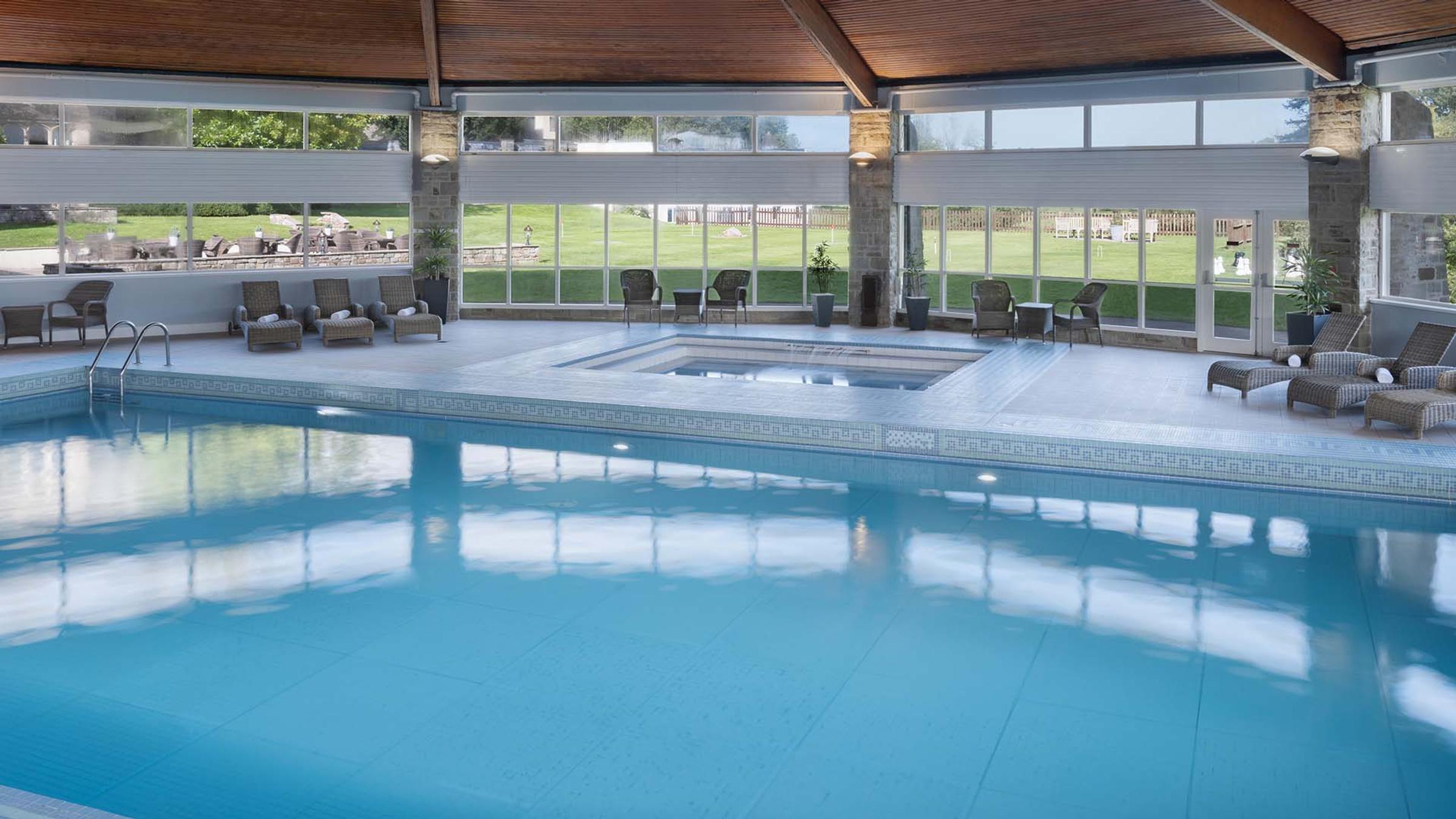 Indoor swimming pool and jacuzzi overlooking the gardens at Delta Hotels St. Pierre Country Club