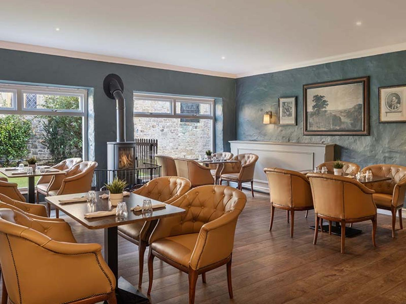 Informal dining lounge with wood burner and garden views
