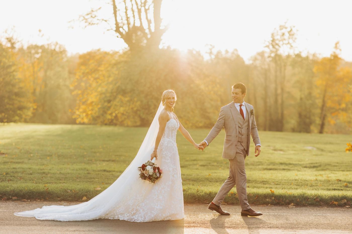Bride and Groom walking in countryside