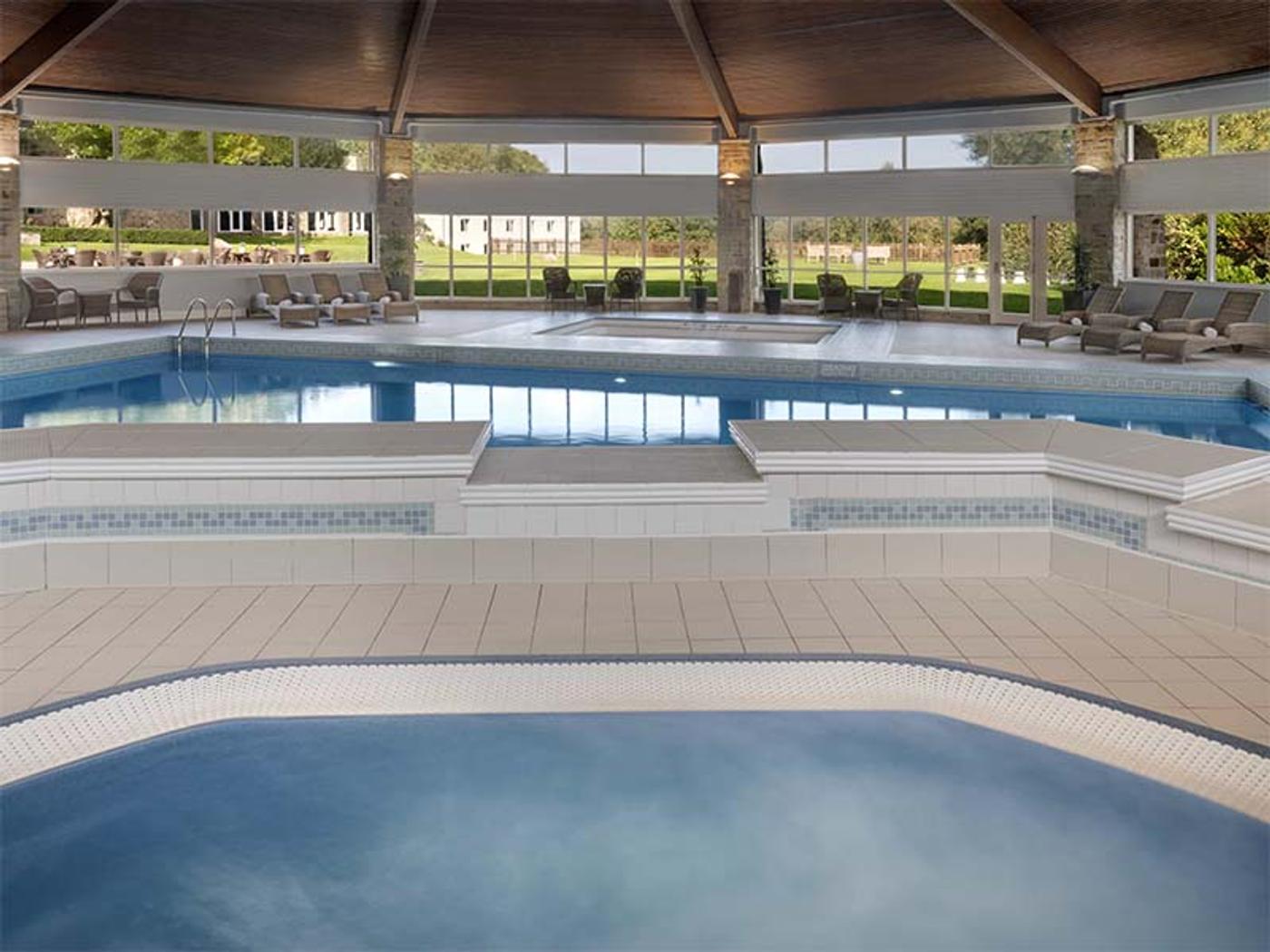 Indoor pool and jacuzzi at Delta Hotels St. Pierre Country Club's spa
