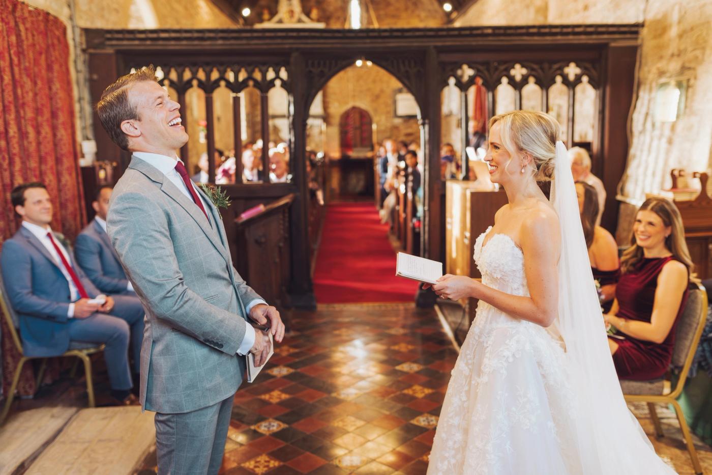 Bride and groom laughing during ceremony