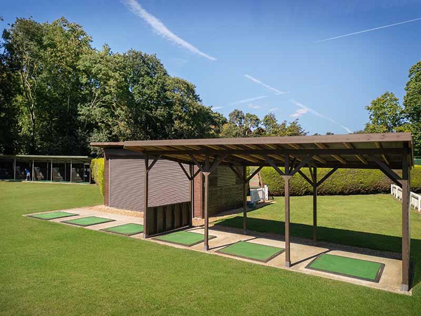 Covered driving range bays at Delta Hotels by Marriott Tudor Park Country Club