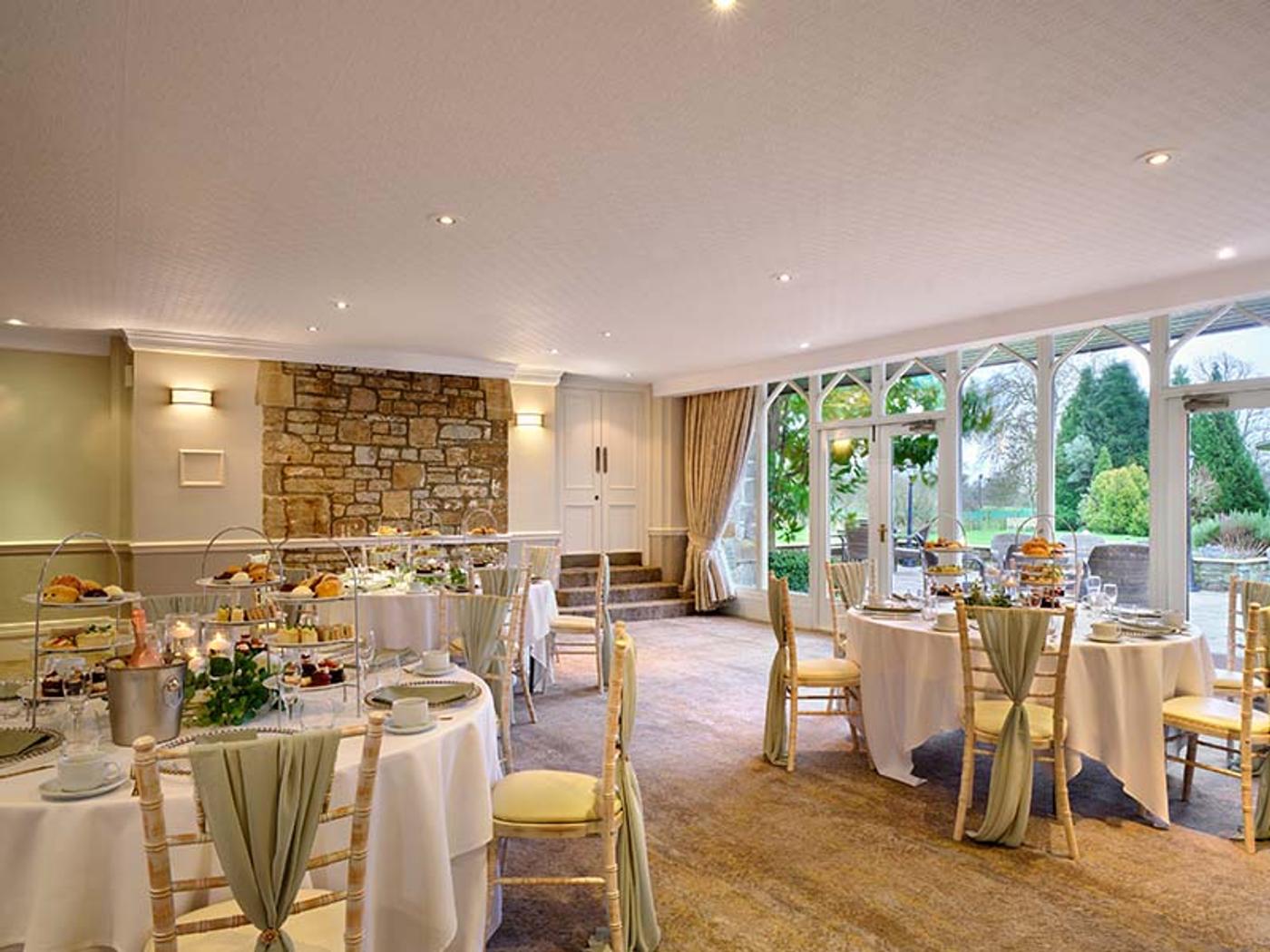 Afternoon tea set in the conservatory overlooking the gardens at Delta Hotels St. Pierre Country Club