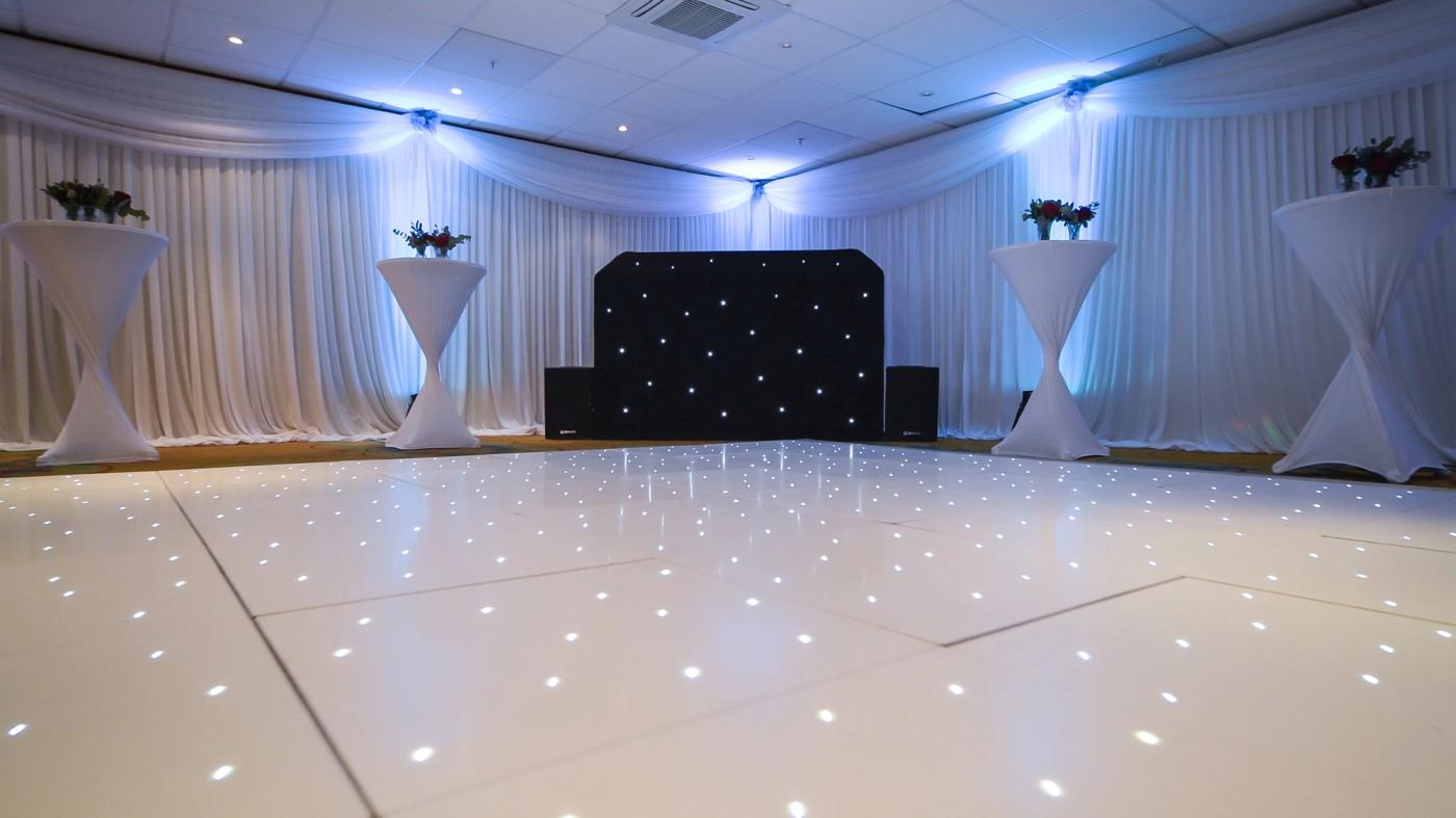 Bearsted room set up with a dance floor and DJ booth