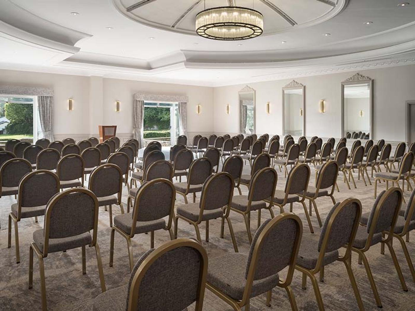 St Pierre Suite set up theatre-style with rows of chairs facing a lectern