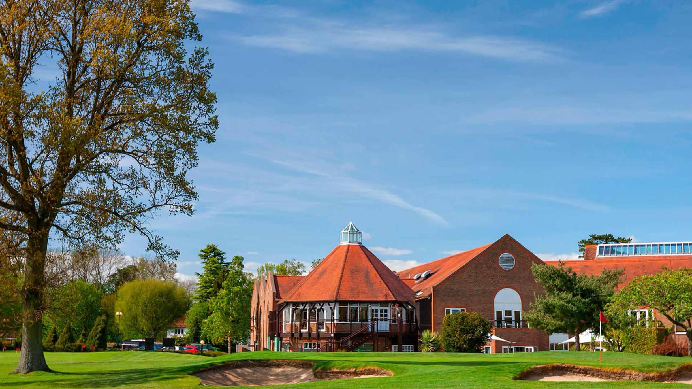 Delta Hotels by Marriott Tudor Park Country Club's clubhouse and golf course under blue sky