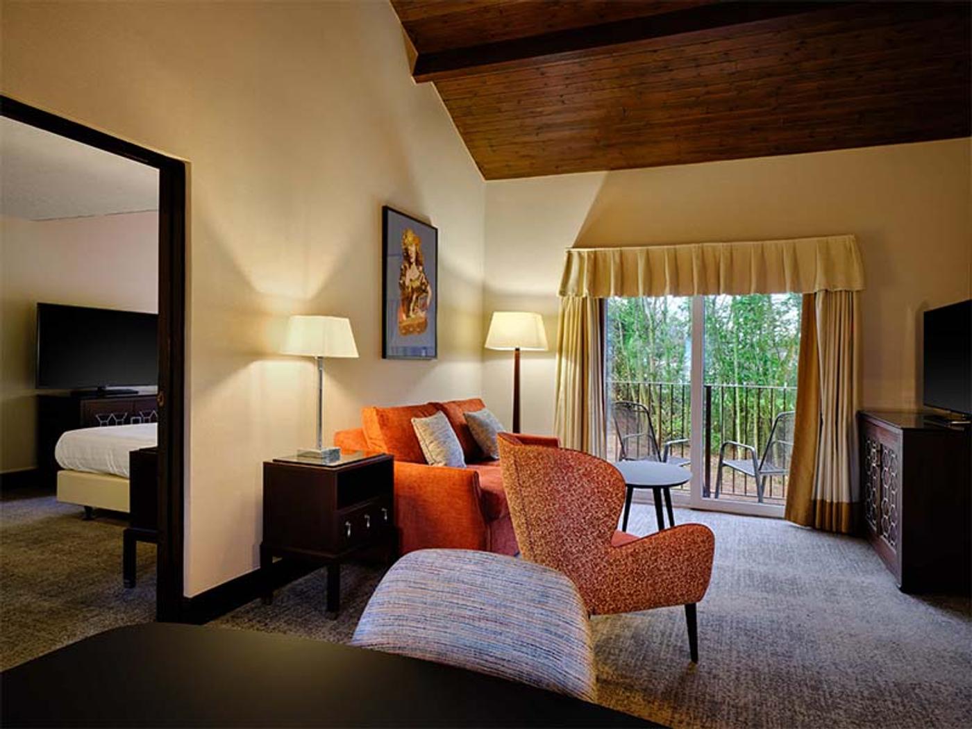 Suite living area with balcony over the woodland