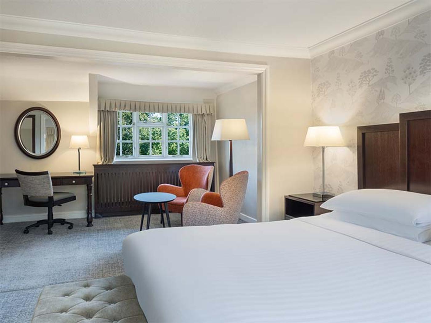 Rose Cottage Honeymoon Suite bedroom at Delta Hotels St. Pierre Country Club