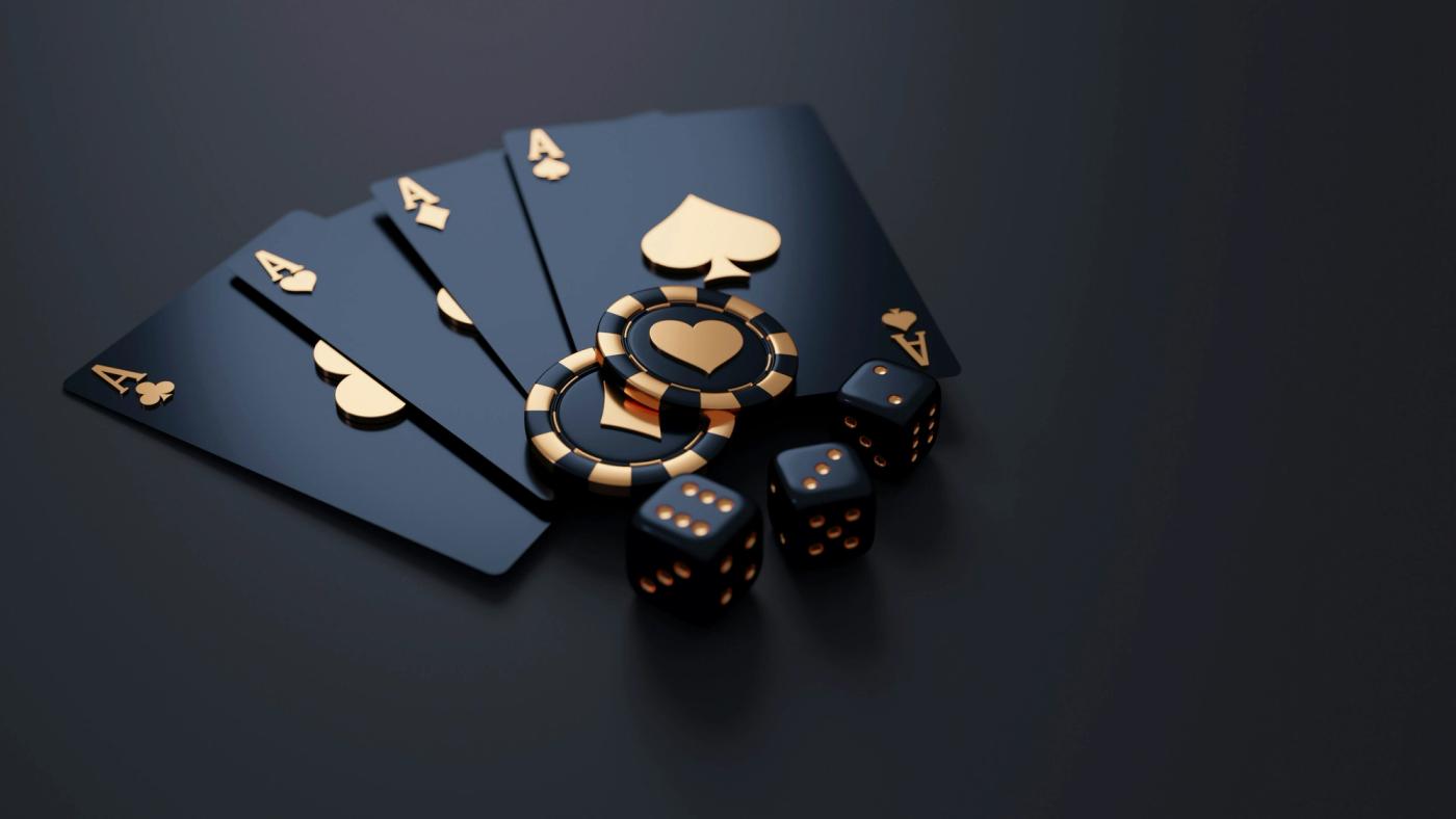 Black and gold playing cards with chips and dice