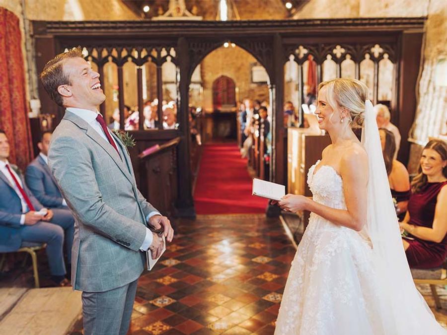 Bride and groom exchanging vows at St. Peters Church