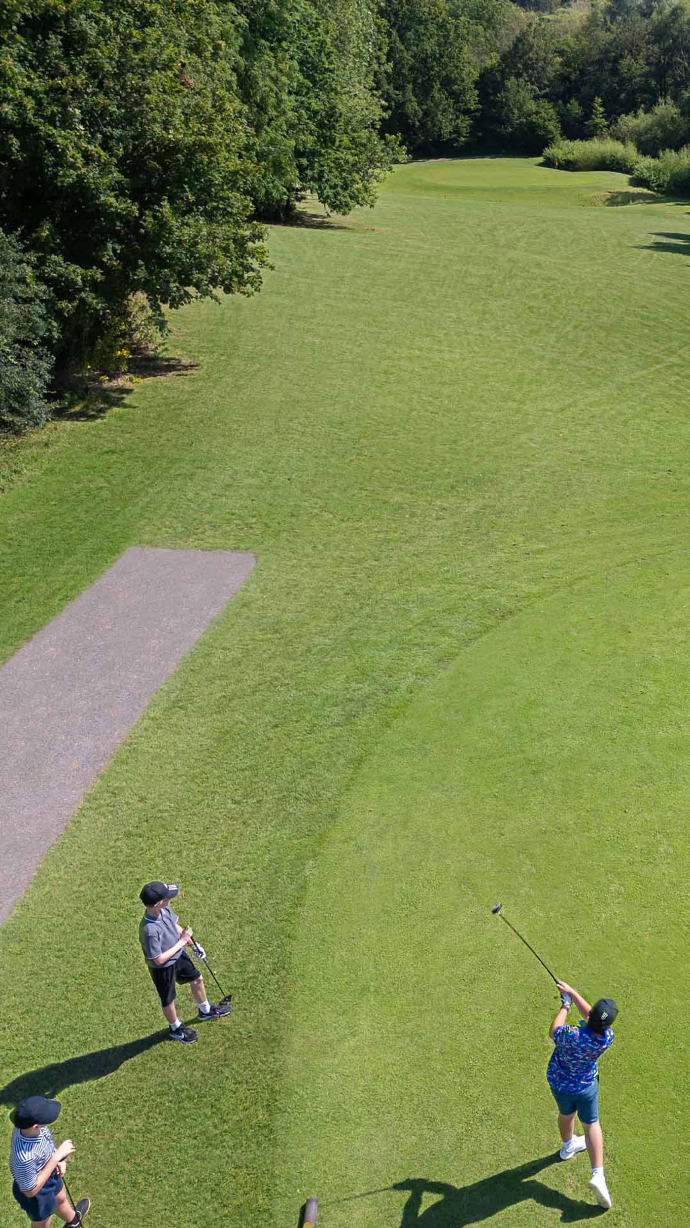 Junior golfer teeing off on the fairway at Delta Hotels by Marriott Tudor Park Country Club