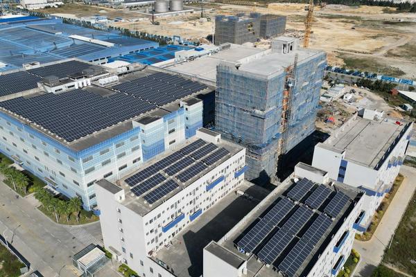 Image of building with renewable energy solar panels.