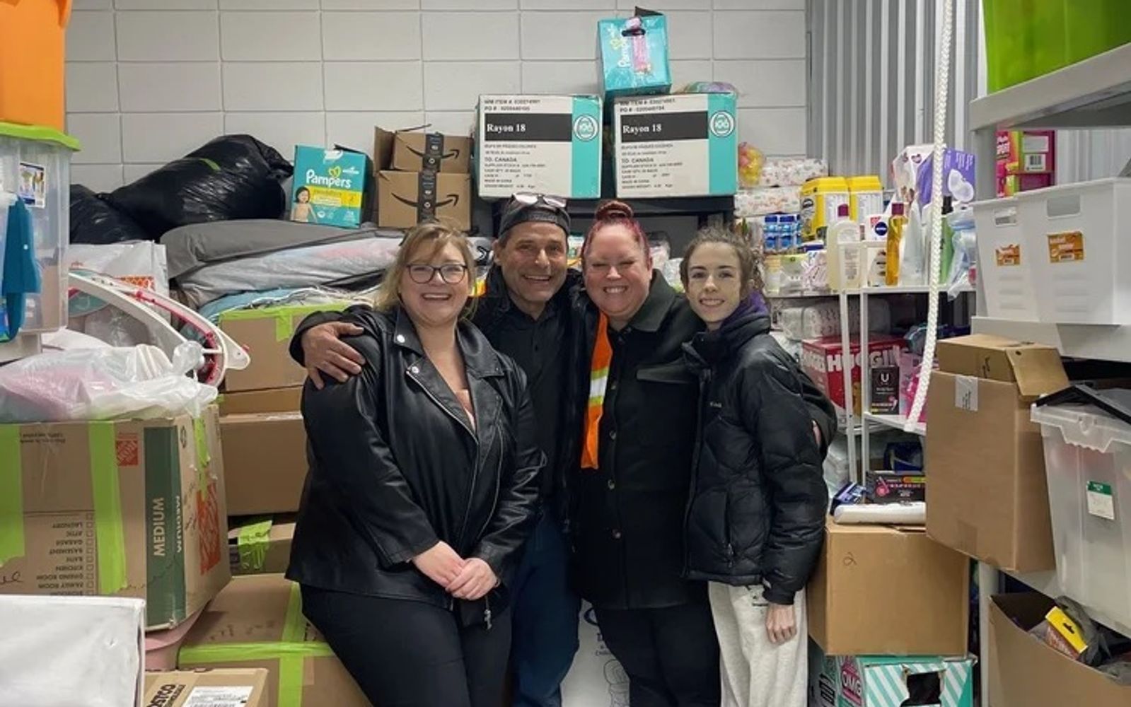 Jackman team members with Mamas for Mamas staff in a donation storeroom.