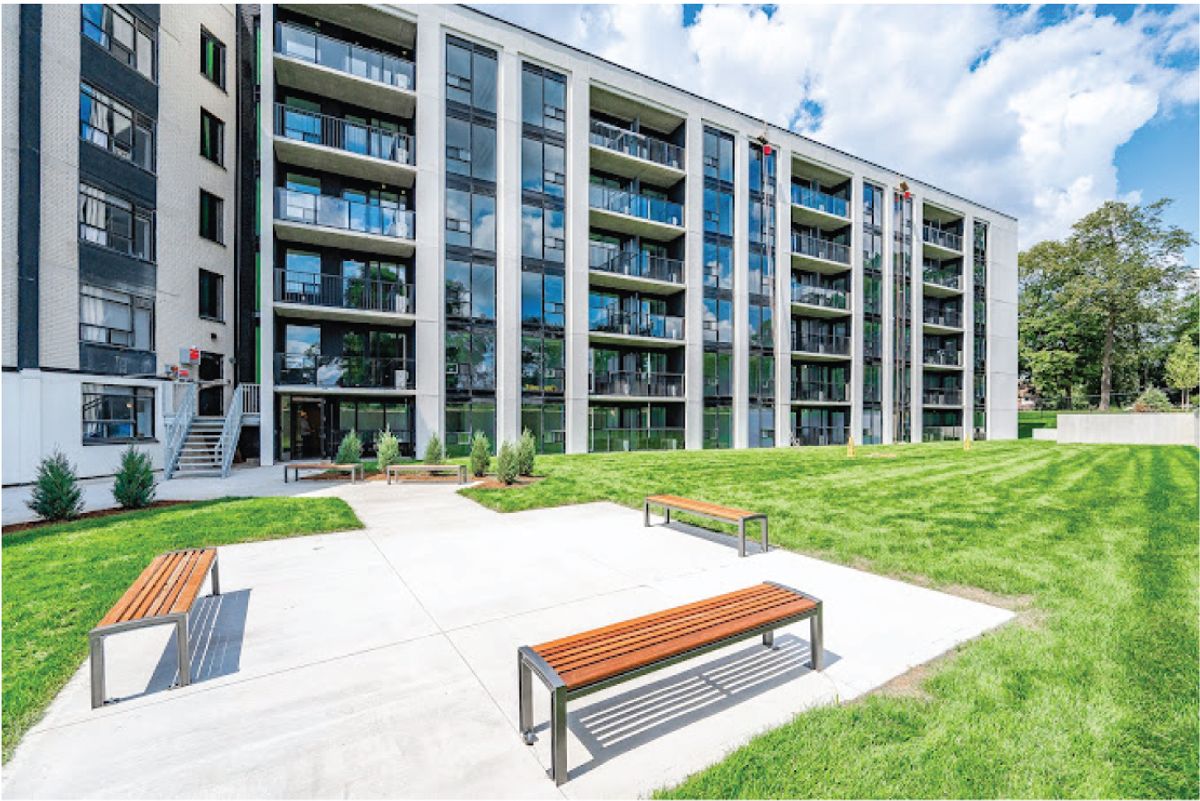 Courtyard and exterior of The Woodside Terraces, a multi-storey residential building at 270 Spadina Ave. in Kitchener.