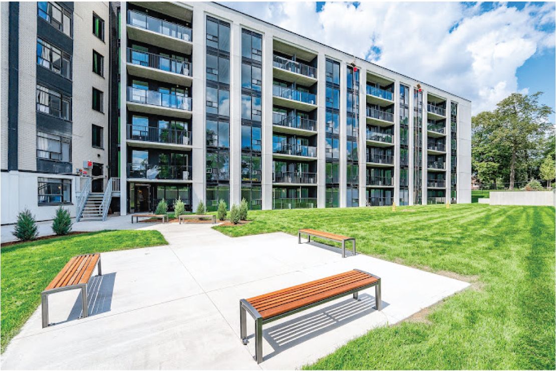 Courtyard and exterior of The Woodside Terraces, a multi-storey residential building at 270 Spadina Ave. in Kitchener.