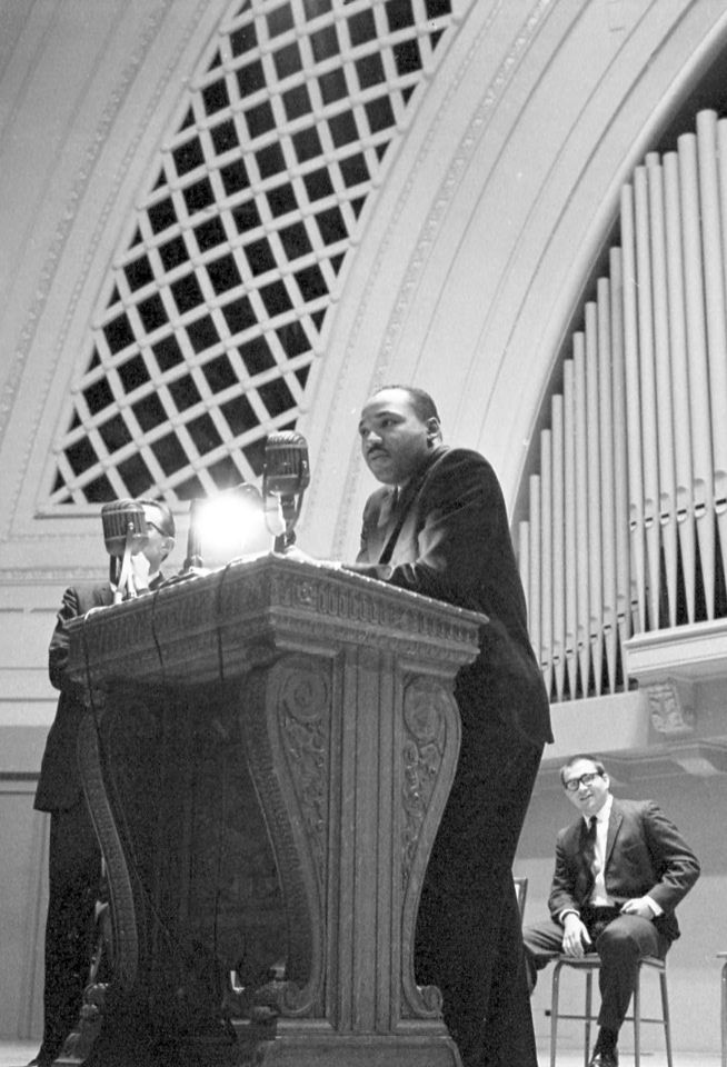 MLK giving a speech at a podium