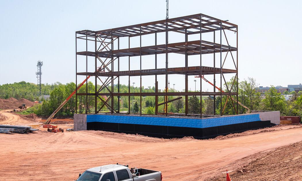 Contractors said the new building would take a minimum of 37 months to build. But UPEI needed the school done in 32 months.