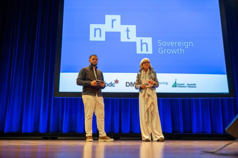 Speakers introduce the conference on stage