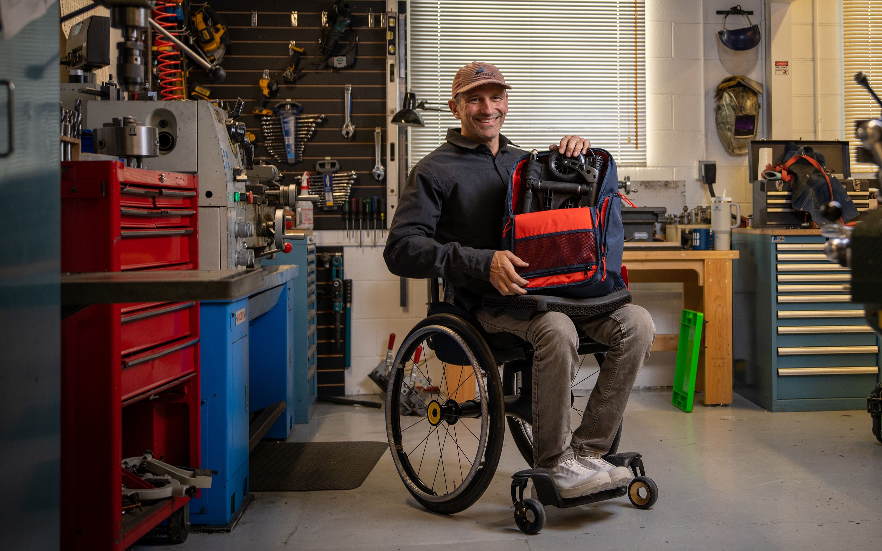 Christian Bagg, founder and chief technology officer of Bowhead Corp, demonstrates the Nano, a collapsible wheelchair that folds to fit inside a backpack, at the companyâs warehouse in Calgary on Tuesday, Oct. 27, 2026.
