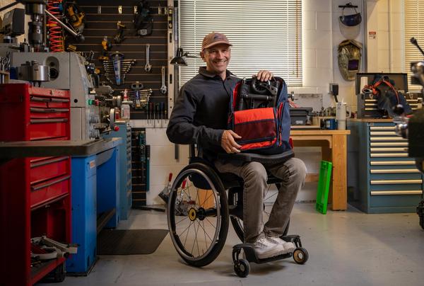Christian Bagg, founder and chief technology officer of Bowhead Corp, demonstrates the Nano, a collapsible wheelchair that folds to fit inside a backpack, at the companyâs warehouse in Calgary on Tuesday, Oct. 27, 2026.