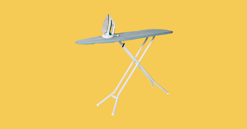 Ironing board and iron on yellow background