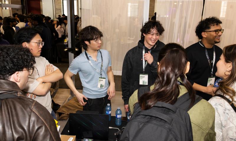 TinyTPU's Evan Lin, Kenny Guo, Xander Chin and Surya Sure, wearing event lanyards, at the Socratica Symposium 2026