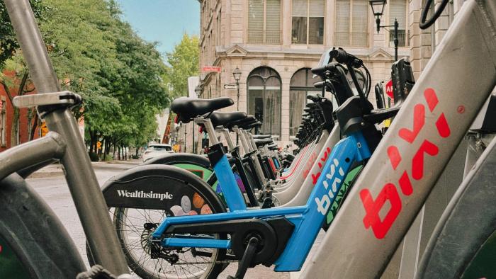 A fleet of Montreal's BIXI bikes with Wealthsimple branding