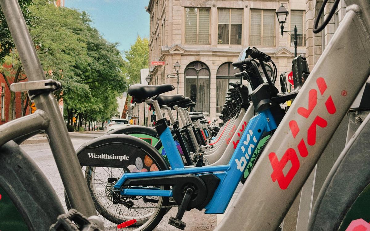 A fleet of Montreal's BIXI bikes with Wealthsimple branding