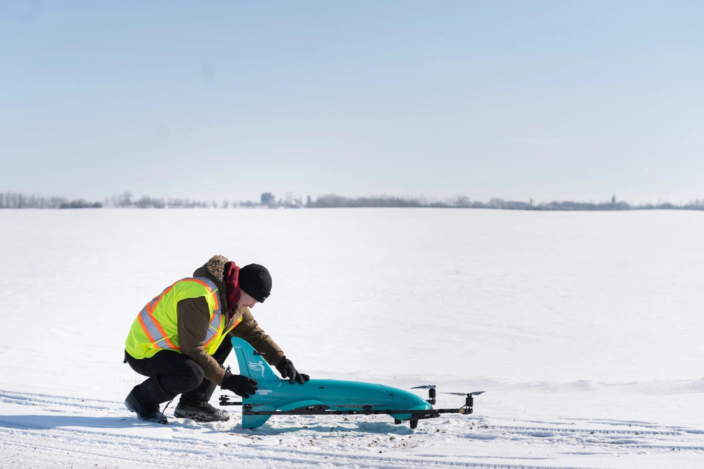 A drone operator setting up AIRmarket's drone, which is set to fly all the way to St. Paul, about 100 kilometres to the northeast, then most of the way back.