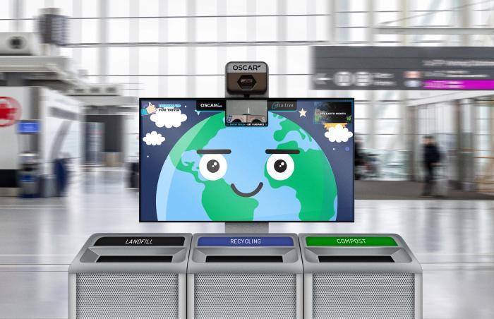 A photo illustration of Oscar Sort AI trash recycling, showing a yellow smiley face and camera on a screen above a set of three trash cans labelled "landfill" "recycling" and "compost"