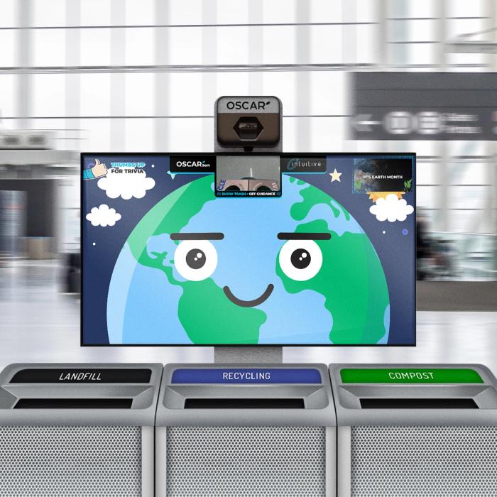 A photo illustration of Oscar Sort AI trash recycling, showing a yellow smiley face and camera on a screen above a set of three trash cans labelled "landfill" "recycling" and "compost"