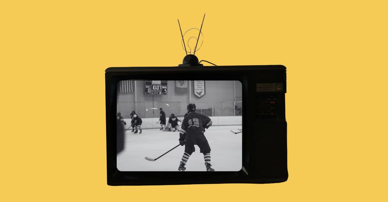 Black and white hockey scene on old school television set on yellow background