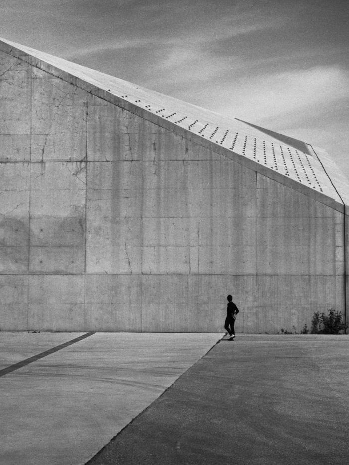 a portrait of architect Pat Hanson, shown in silhouette outside Toronto's Cherry Street Stormwater Management