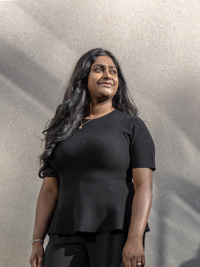 Nivatha Balendra, founder and CEO of Dispersa, standing outside her laboratory in Montreal, QC.