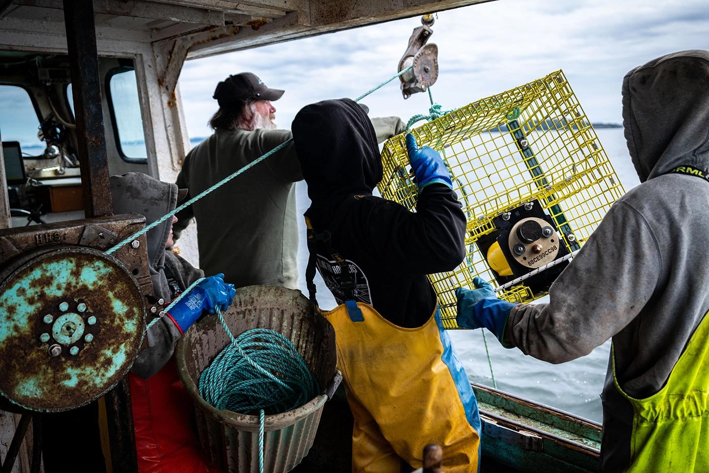 Fishers working on a crate for on-demand fishing.