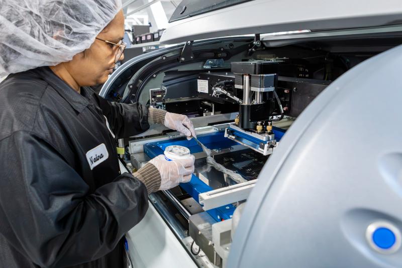 A worker at MDA Space's high-volume satellite production facility in Montreal.